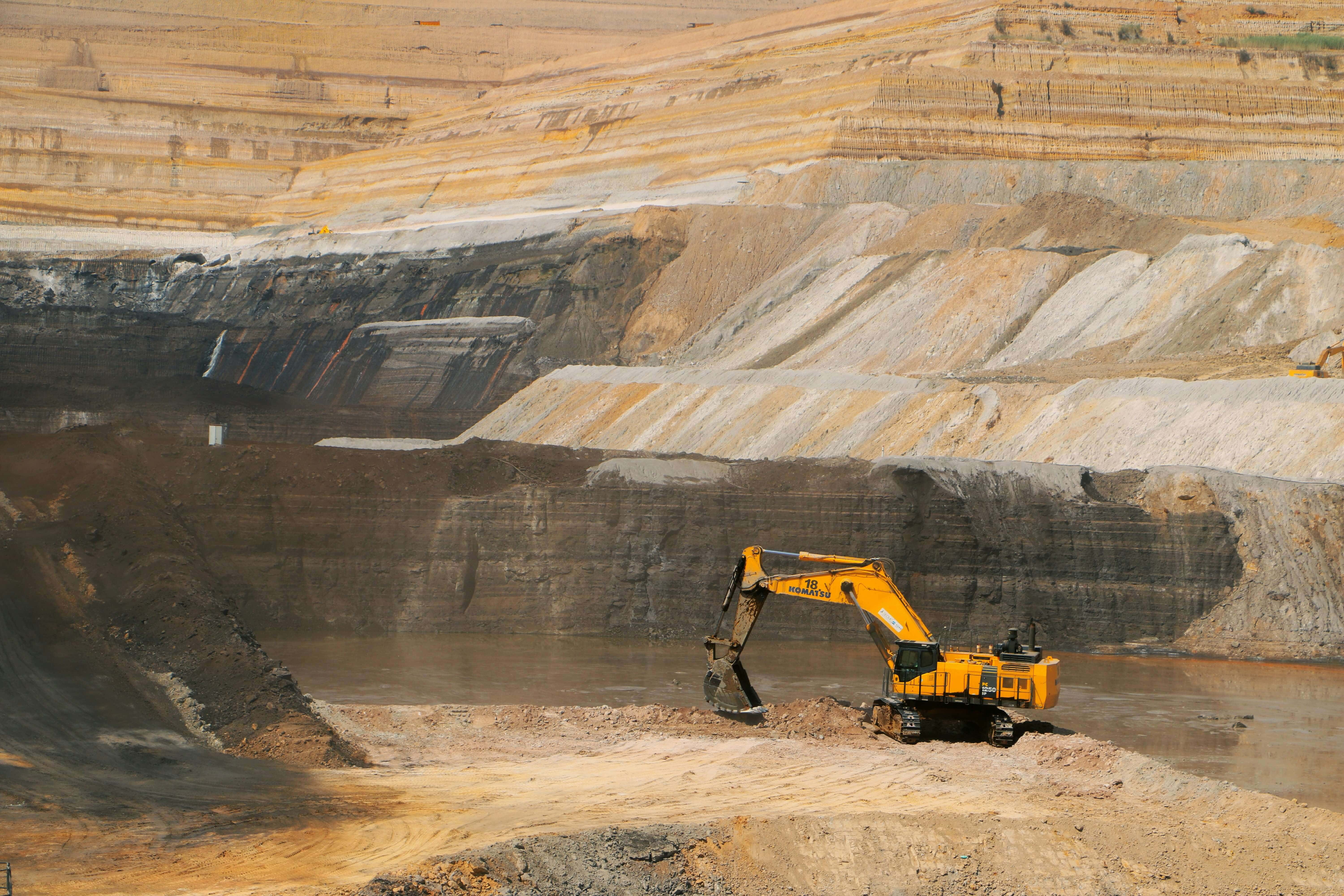 Massive industrial excavator operating in an open-pit mine
